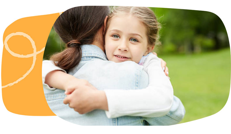 Foster mother with daughter in park